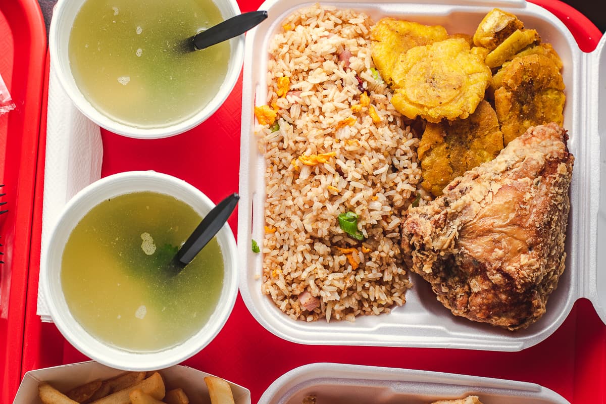 Soup, fried rice, tostones, and fried chicken at Asian Sofrito (Credit: Jackie Tran)