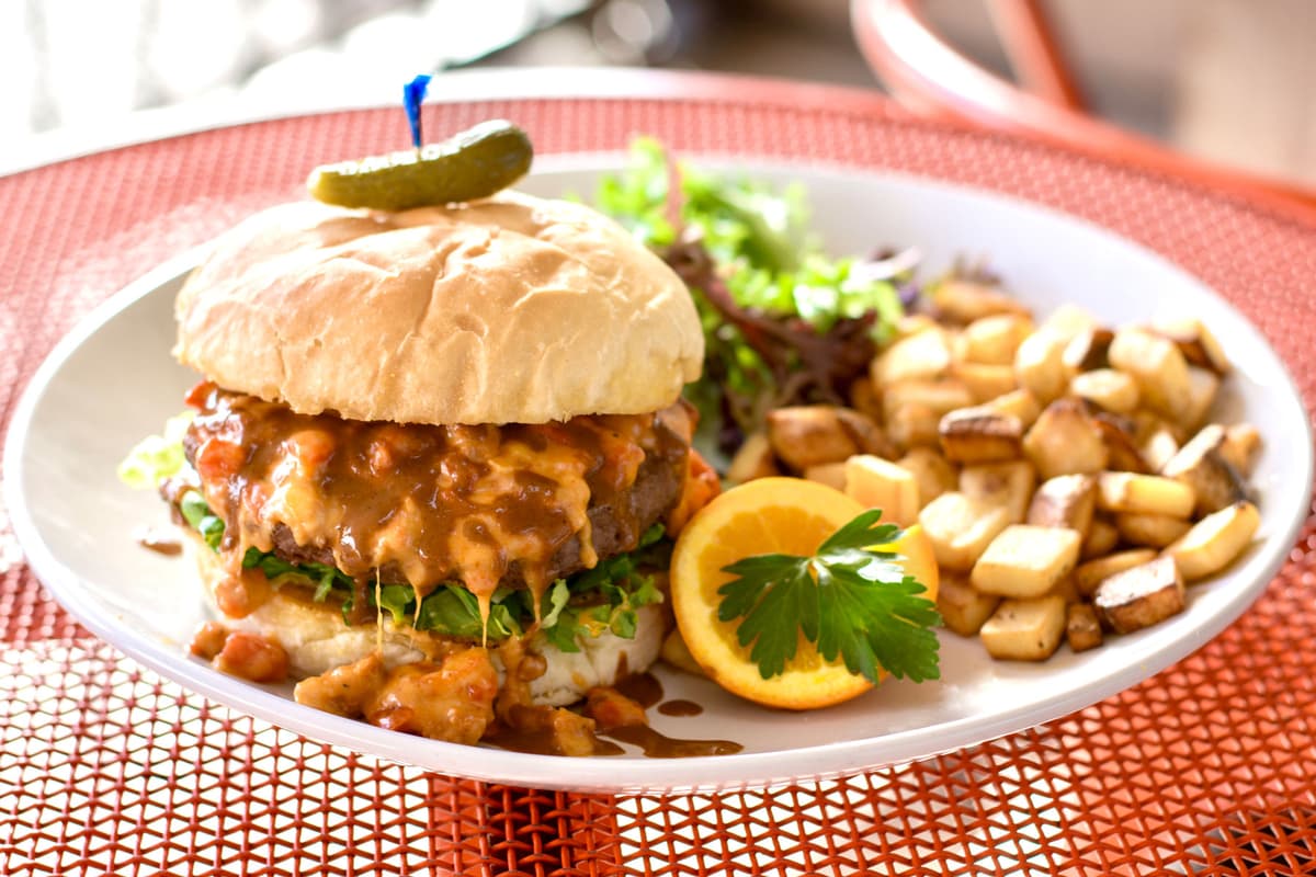 Chorizo Roasted Red Pepper Four Cheese Burger w/ Molé Drizzle at Ghini's French Caffe.
