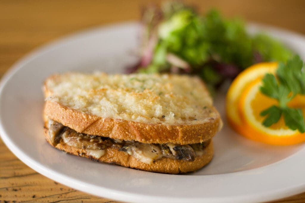 a sandwich cut in half on a plate