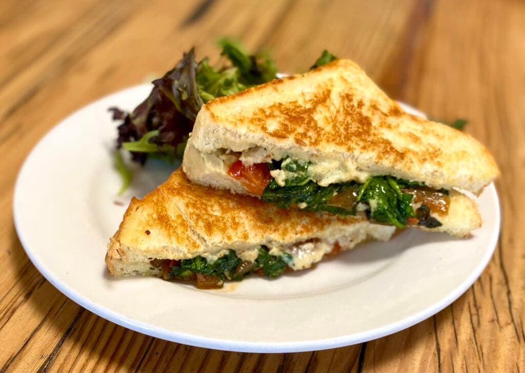 a sandwich cut in half on a plate