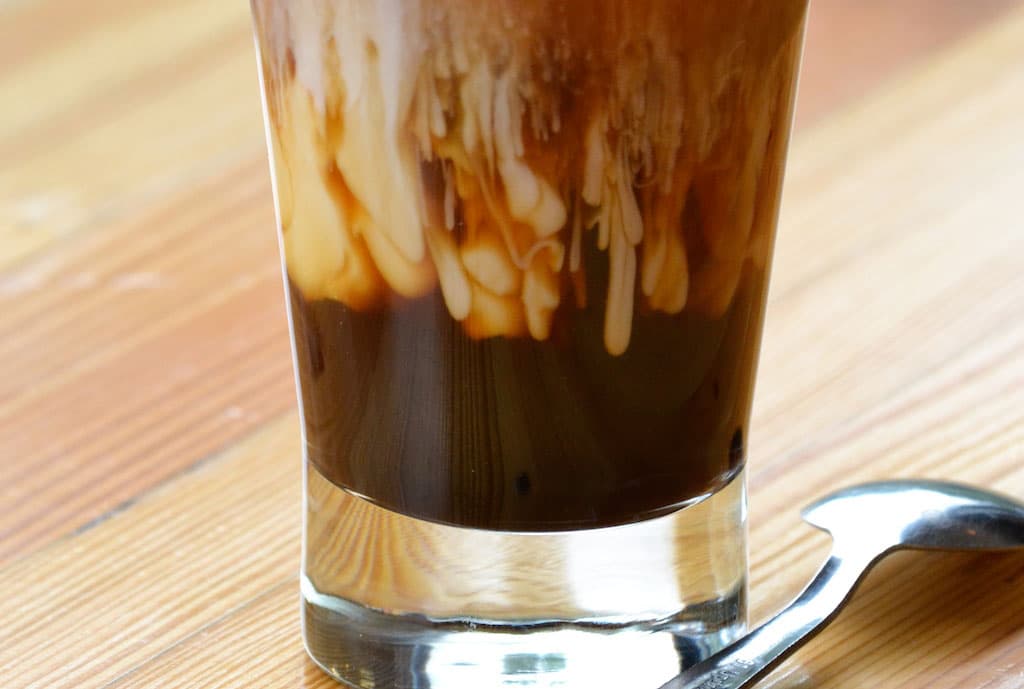Iced Americano with Macadamia Milk at Brewd