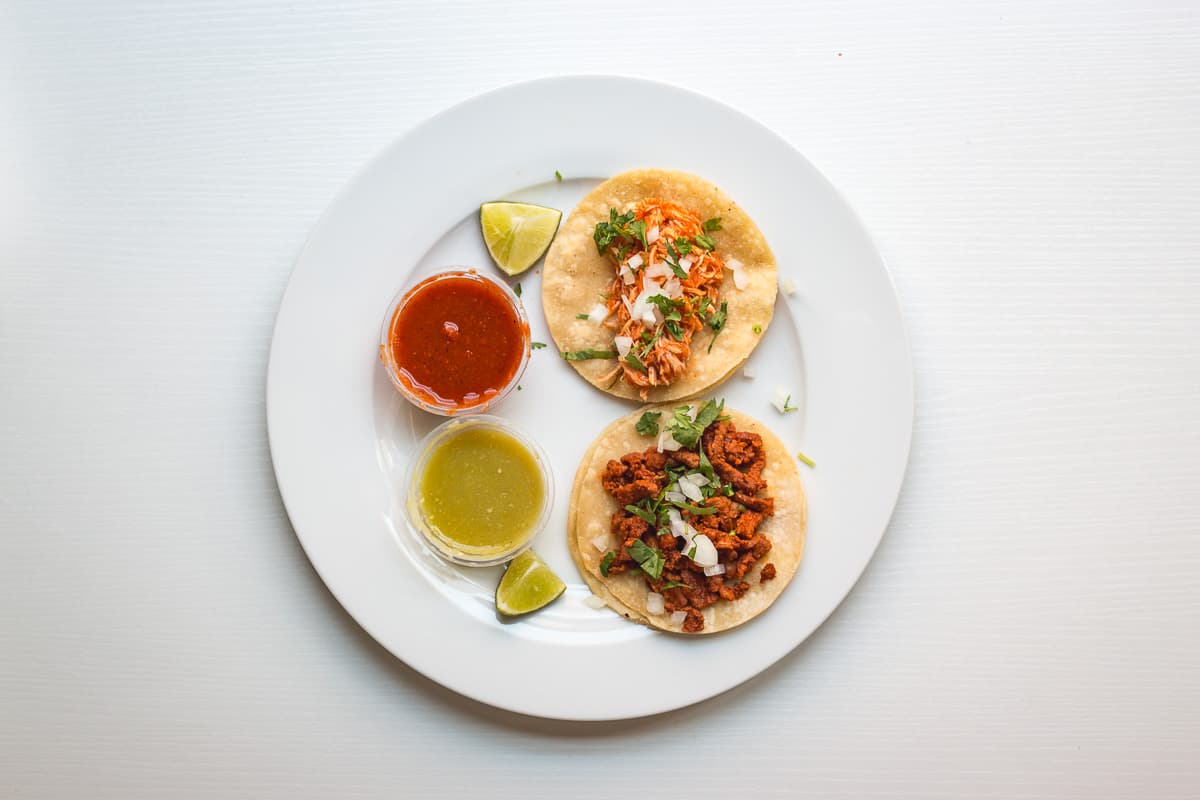 Chicken in Chiltepin and Pork Adobado tacos from El Antojo Poblano