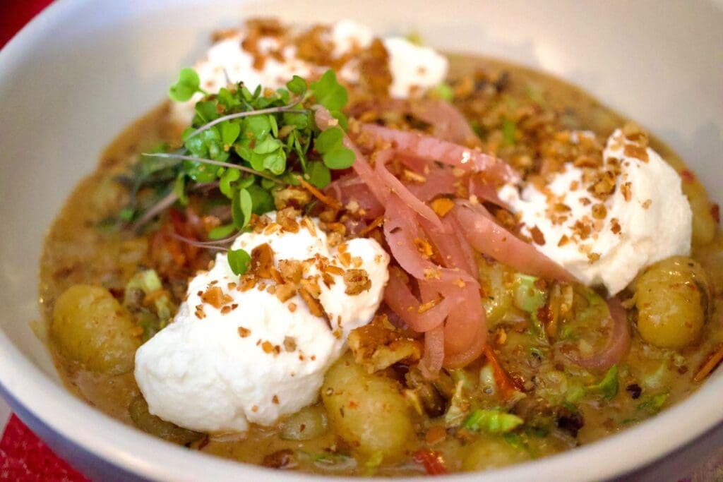 a close up of a bowl of food on a plate