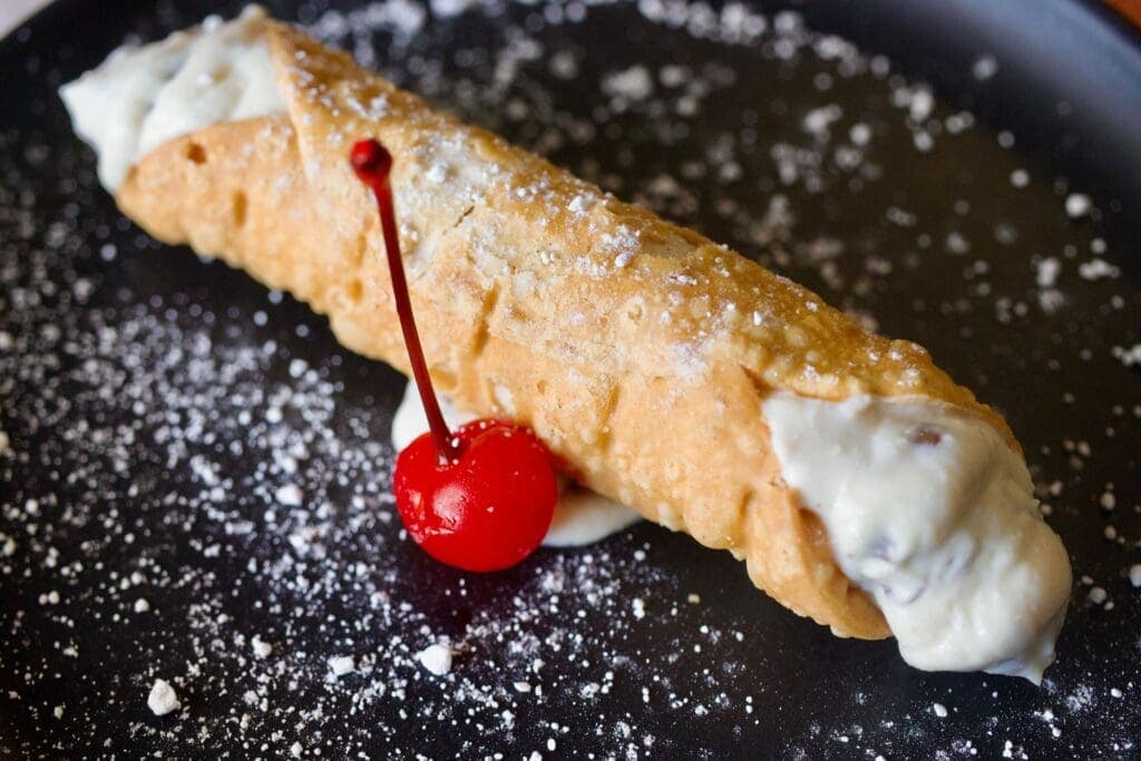 a close up of a piece of cake and ice cream on a plate