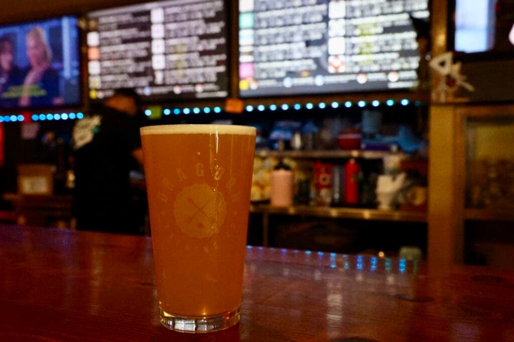 a glass of beer on a table
