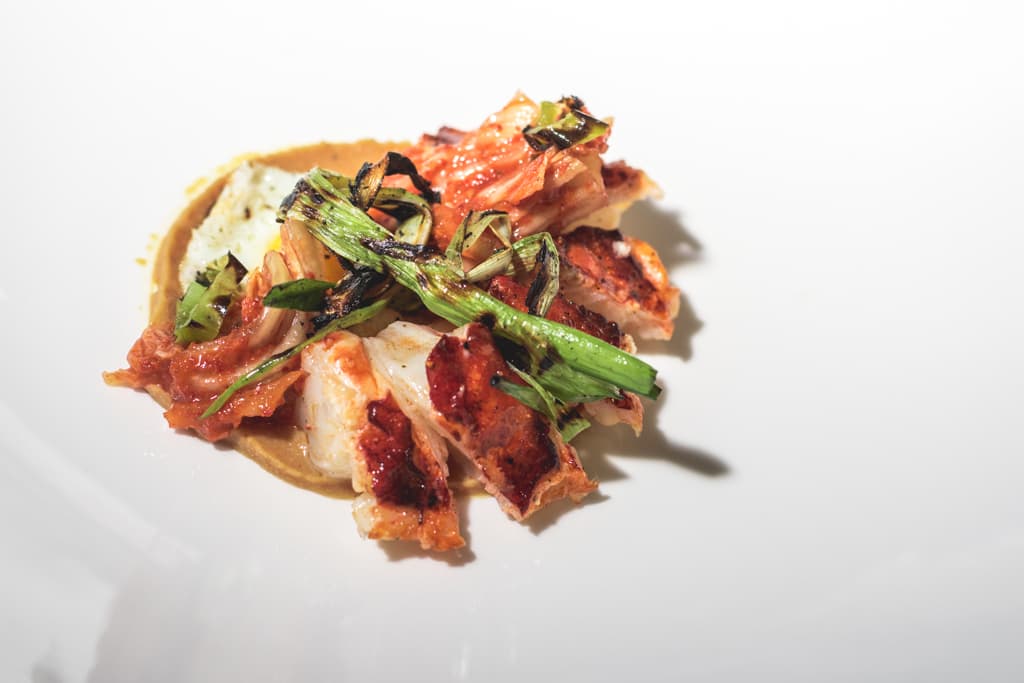 Sous vide lobster with kimchi, charred scallion, quail egg, and miso butter at Miraval Arizona (Credit: Jackie Tran)