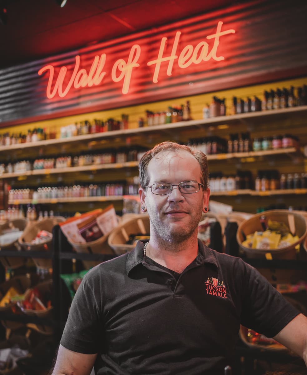 Erik Buehler & his 'Wall of Heat' at Tucson Tamale (Photo by Isaac Stockton)