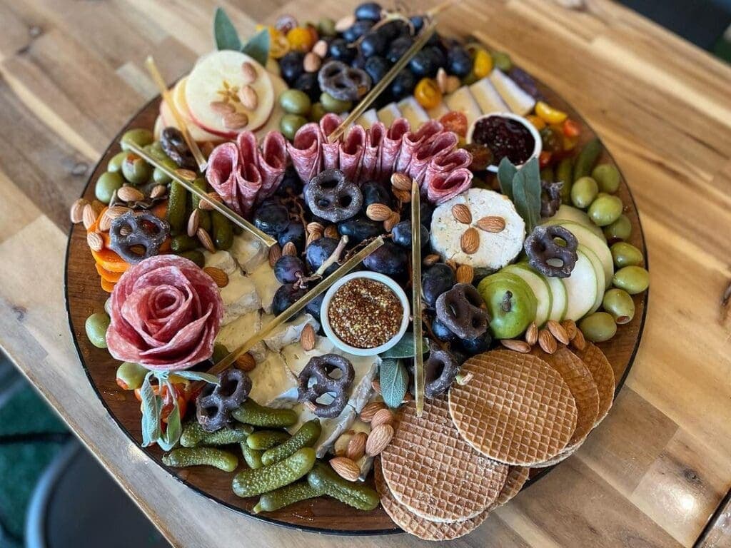 a cake with fruit on top of a wooden table