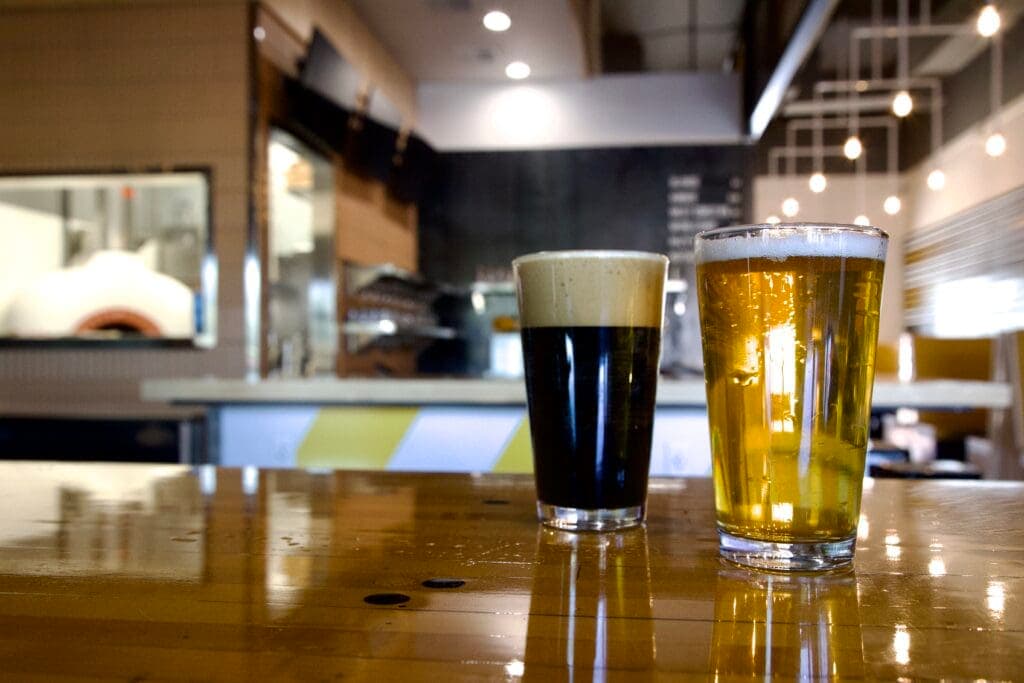 a glass of beer on a table