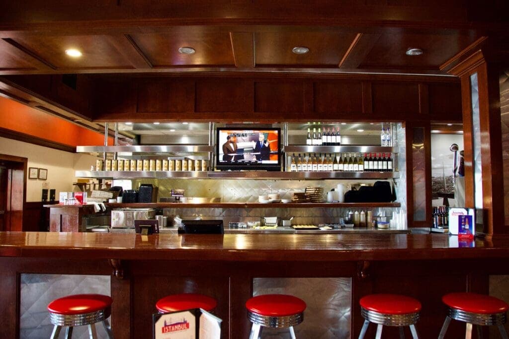 a kitchen with a table in a restaurant