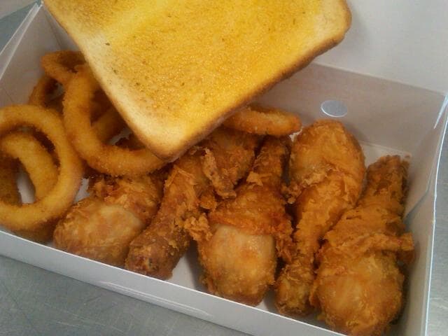 Fried chicken, onion rings, and garlic toast at Lucky Wishbone (Credit: Lucky Wishbone on Facebook)