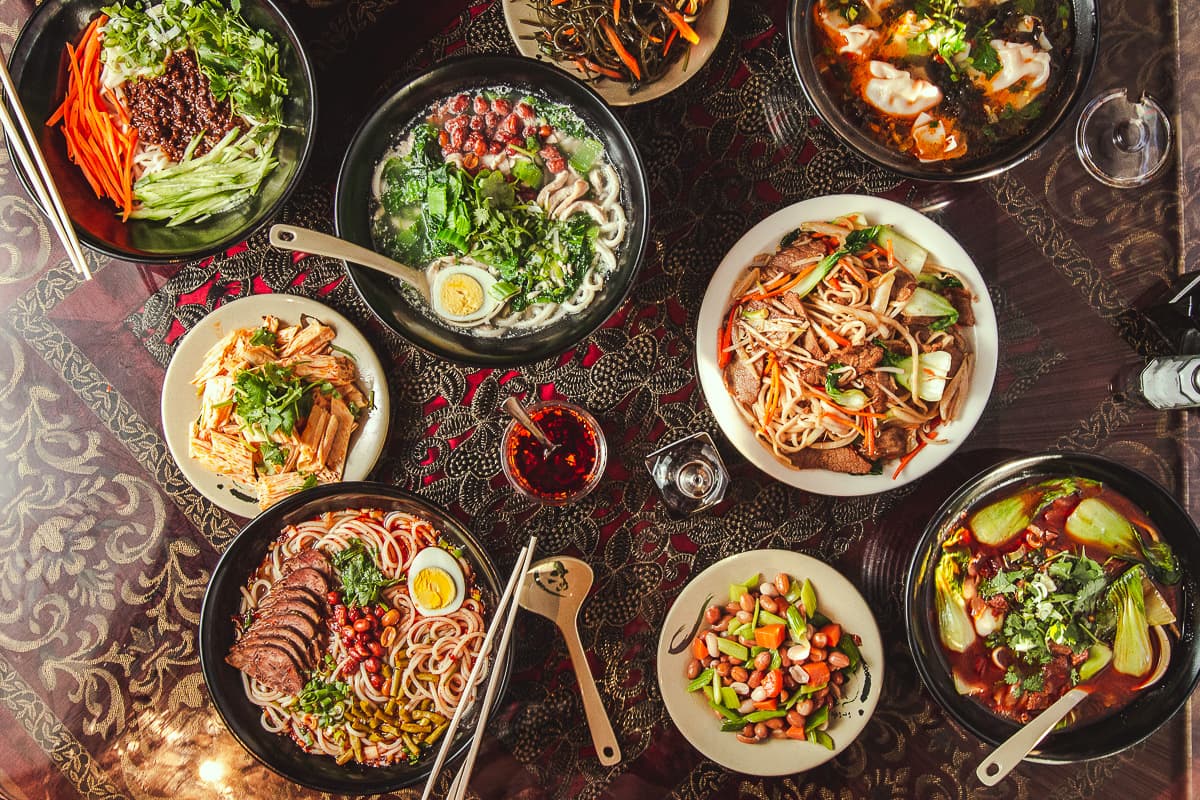 Food spread at Just Noodles (Credit: Jackie Tran)