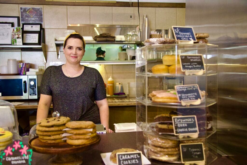 a person standing in a kitchen preparing food