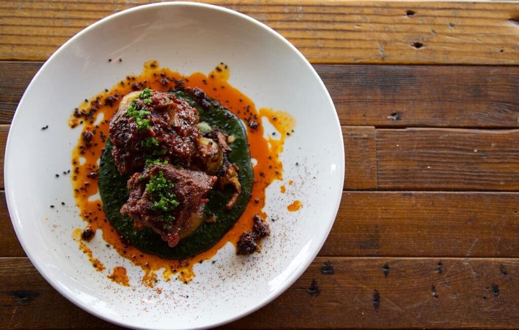 a plate of food on a wooden table