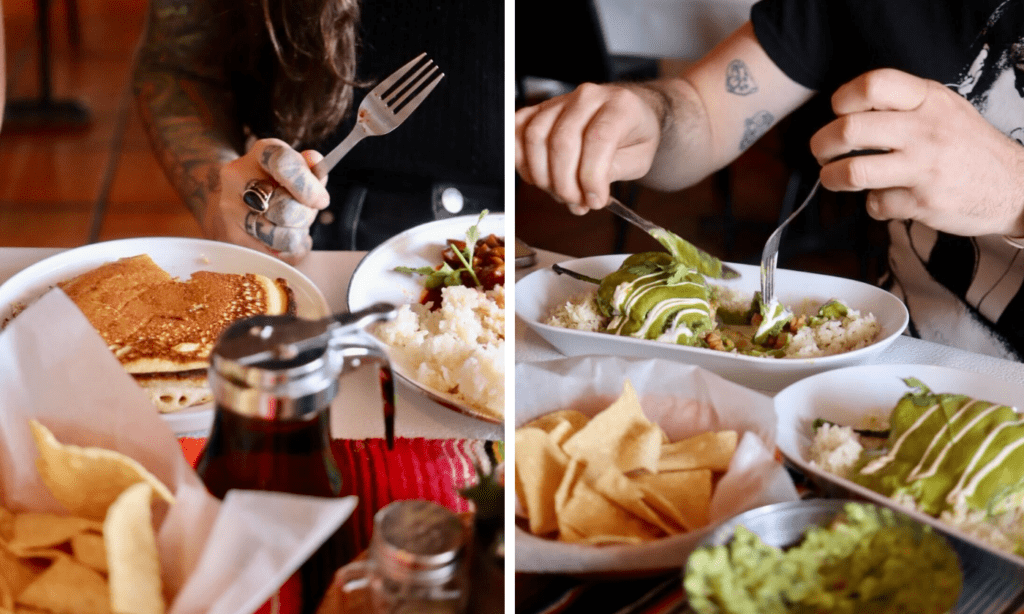 a woman sitting at a table with a plate of food