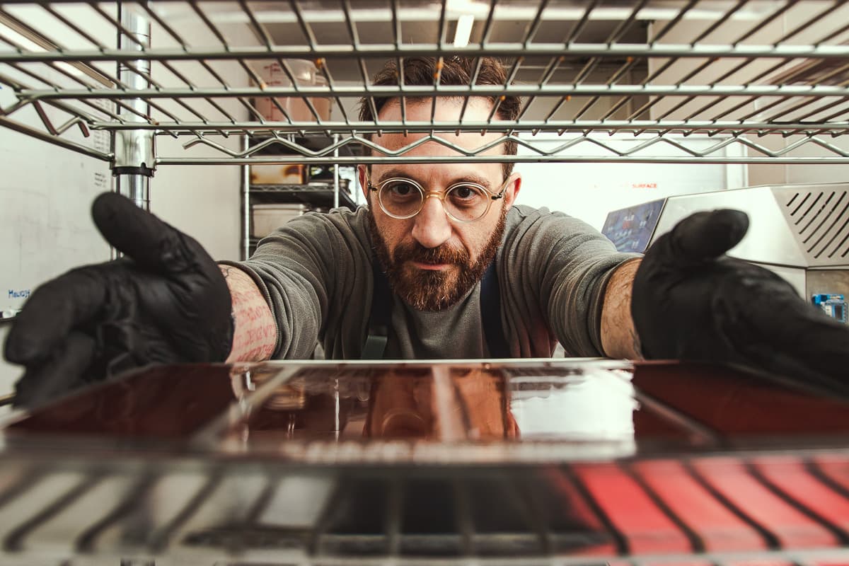 Adam Krantz making chocolate bars at Monsoon Chocolate (Credit: Jackie Tran)