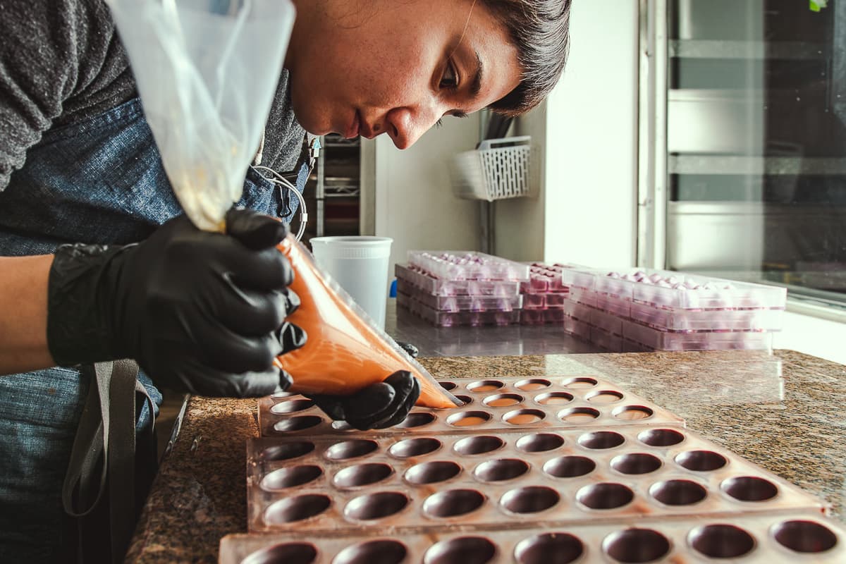 Athene Kline making bon bons at Monsoon Chocolate (Credit: Jackie Tran)