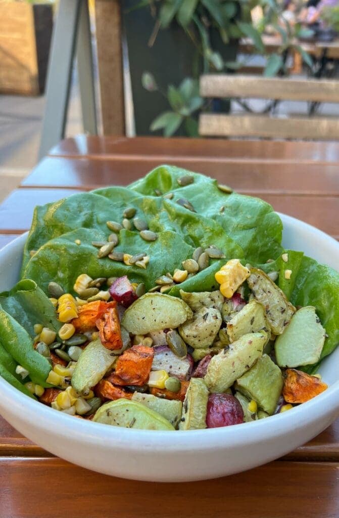 a bowl of food on a plate on a table