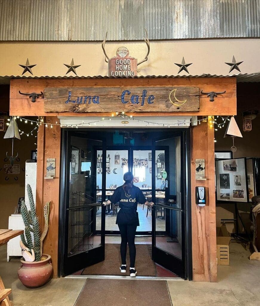 a person standing in front of a store
