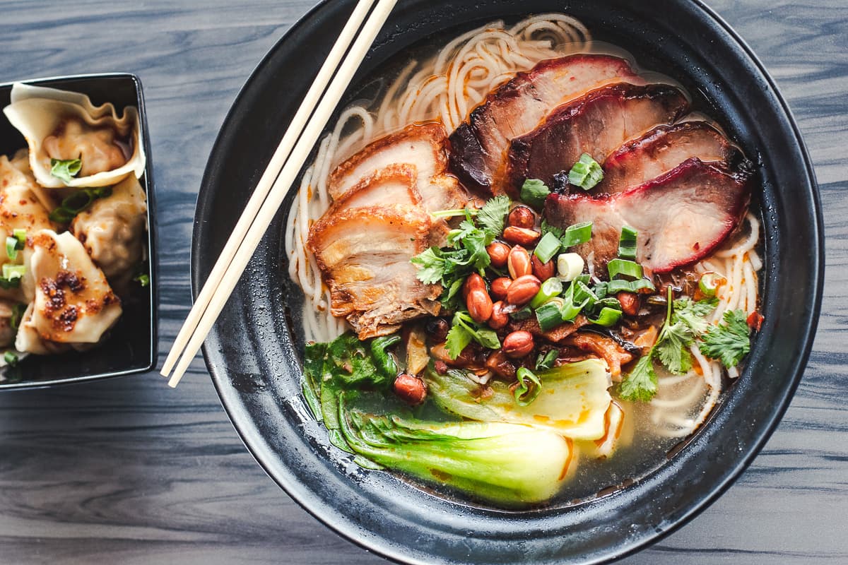 Chaoshou Dumplings and the Guilin Spicy & Sour noodle soup at Noodleholics (Credit: Jackie Tran)