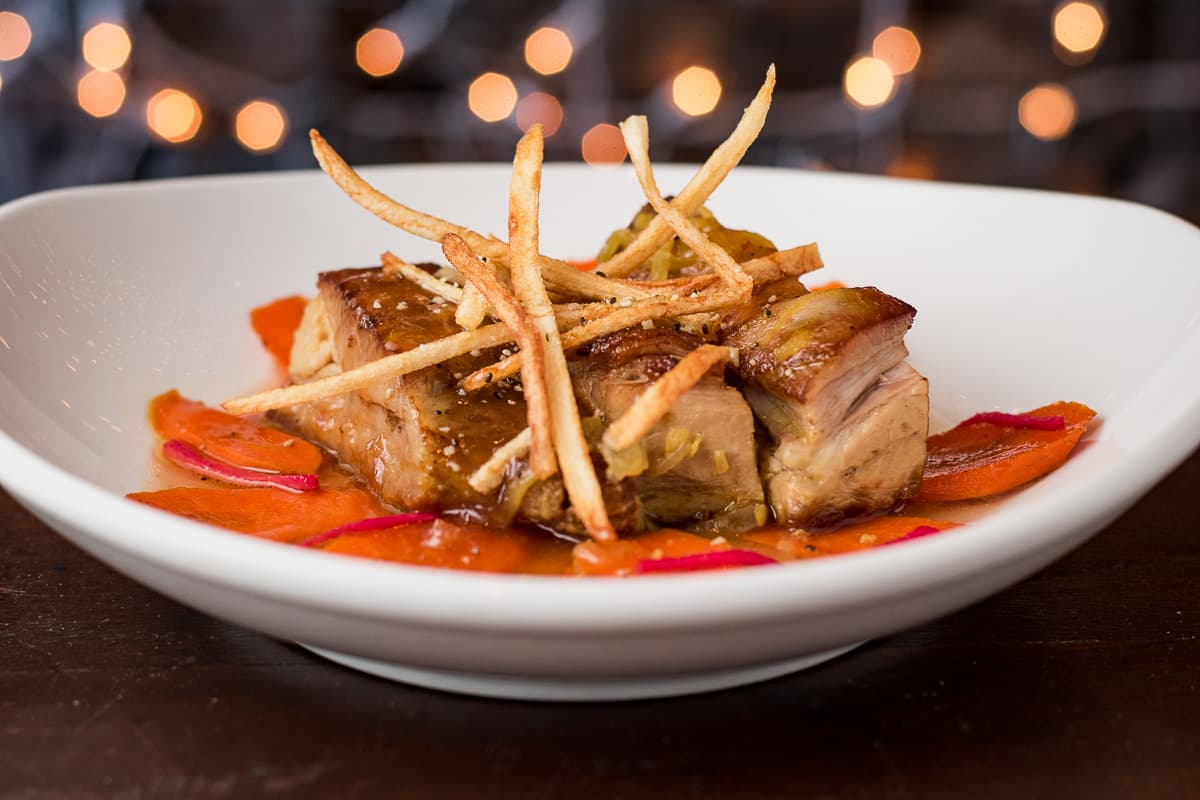 Braised, Seared Tumeric Pork Shoulder + Plum Sauce at DOWNTOWN Kitchen + Cocktails (Credit: Jackie Tran)