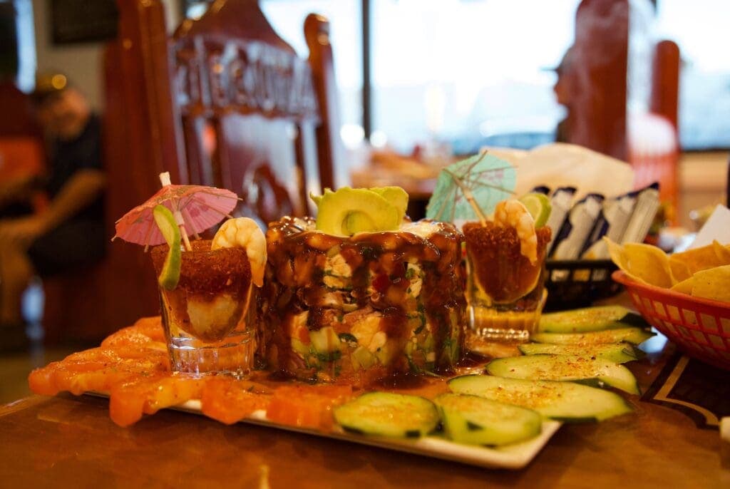 a plate of food with a slice of cake on a table