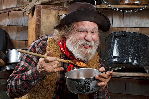 a man cooking in a kitchen