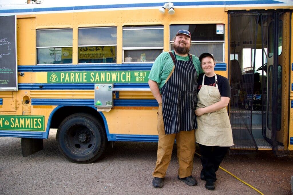 a man standing in front of a bus