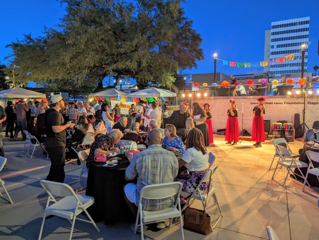a group of people standing in front of a crowd