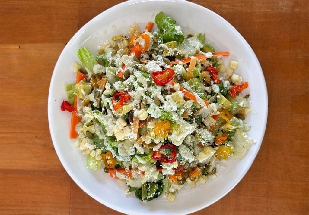 a bowl of salad on a plate