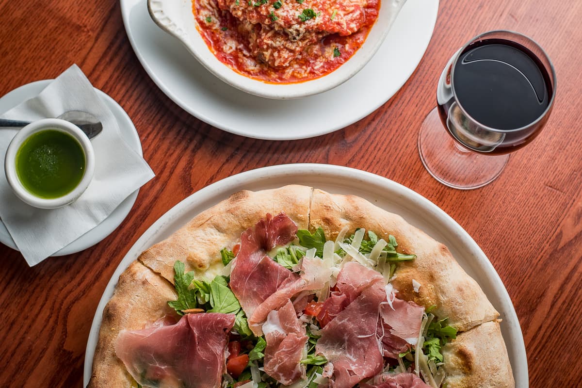 Eggplant Parmesan and Prosciutto di Parma Rotondo Pizza at Scordato's Pizzeria (Credit: Jackie Tran)