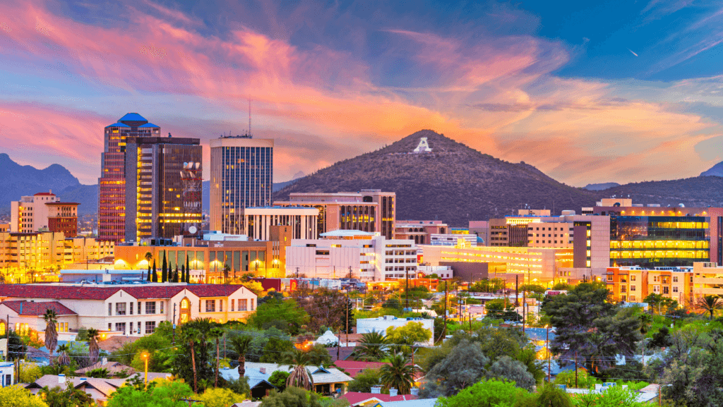 a large building with a mountain in the background