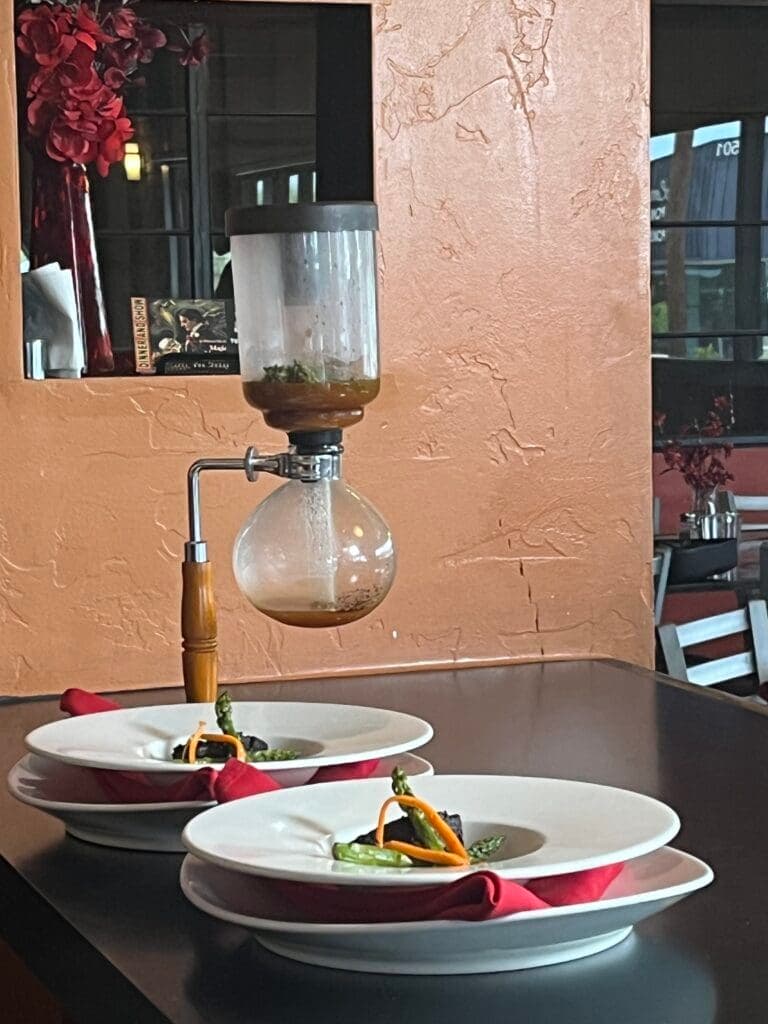 a glass of wine on a table