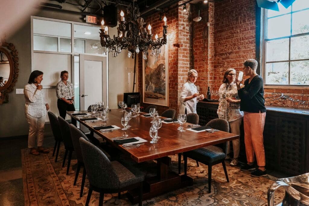 a group of people sitting at a table in a room