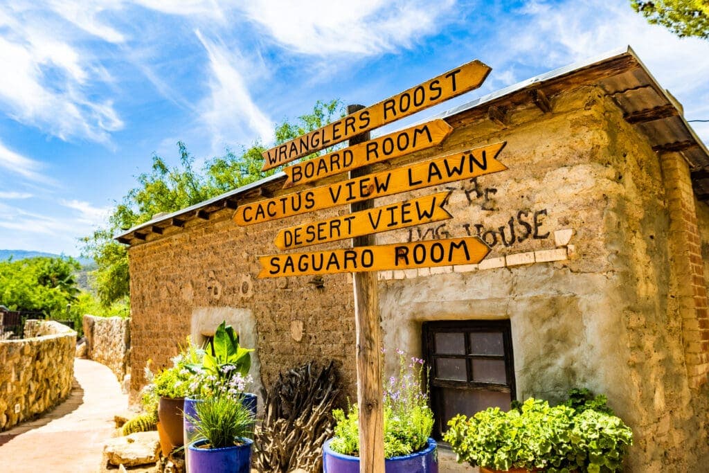 a sign in front of a brick building