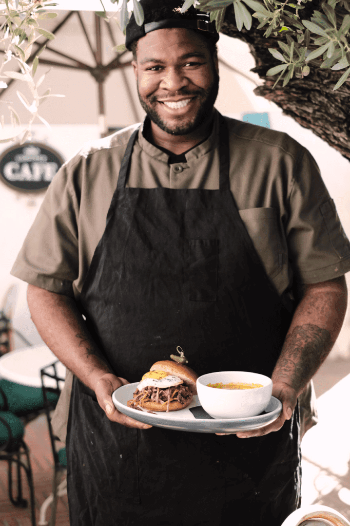 a man holding a plate of food