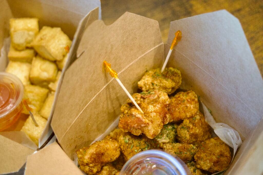 a box filled with different types of food on a table