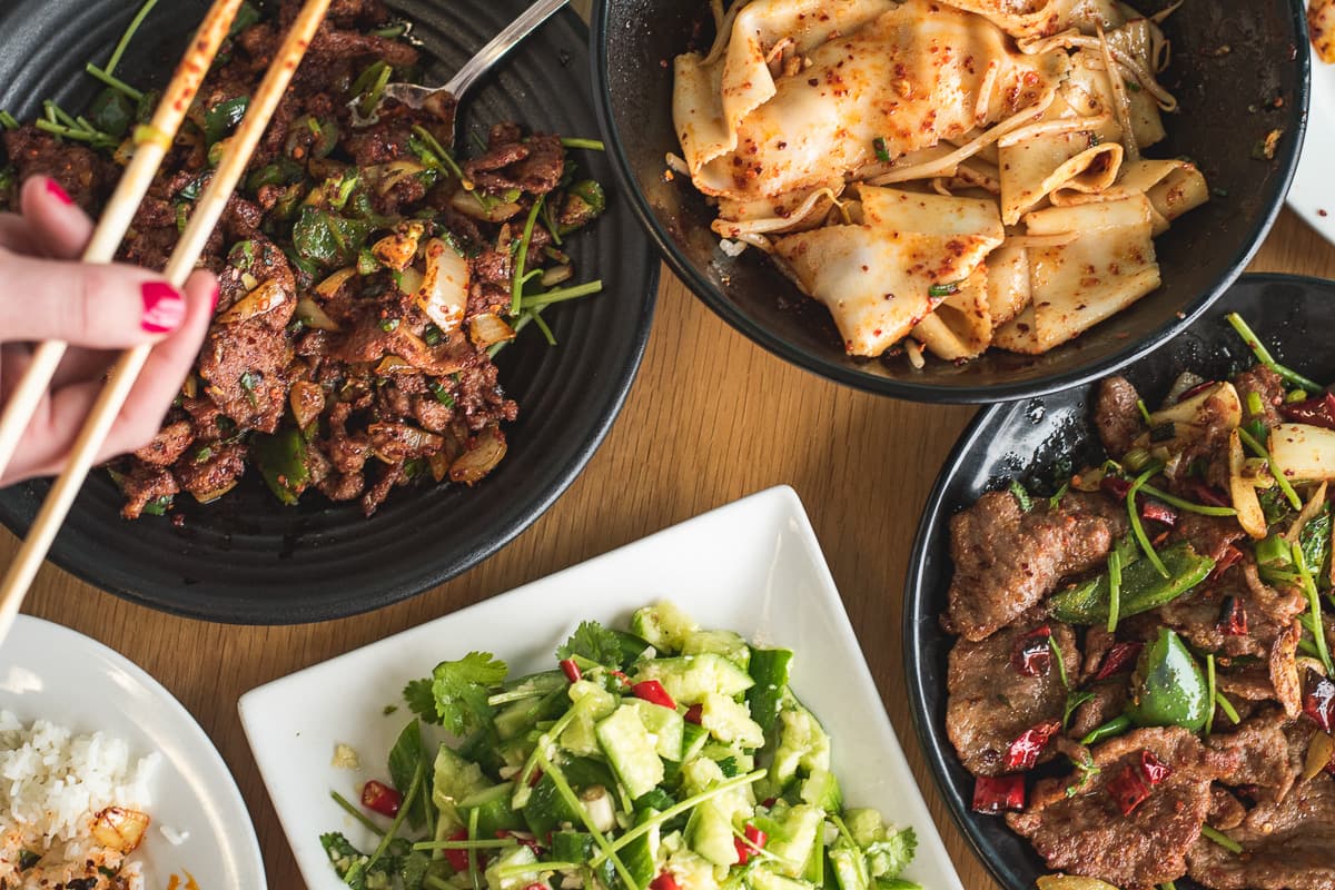 Pan Fried Lamb with Cumin, Xian Oil Splashing Noodle, Cucumber with Garlic Sauce, and Tender Beef with Vegetable in Chili Sauce at Fatman Kitchen (Credit: Jackie Tran)