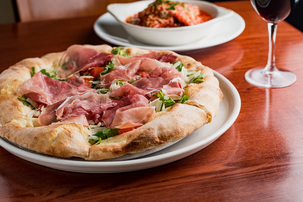 Prosciutto di Parma Rotondo, Arugula, and Fresh Tomatoes Pizza at Scordato's Pizzeria (Credit: Jackie Tran)