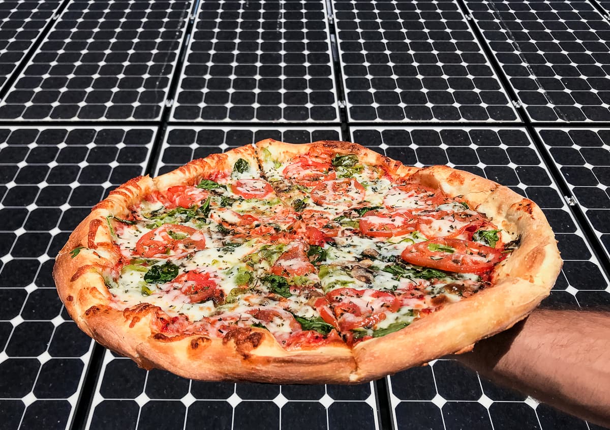 Vegetable Pizza in front of solar panels at Brooklyn Pizza Company (Credit: Claire Kaufman)