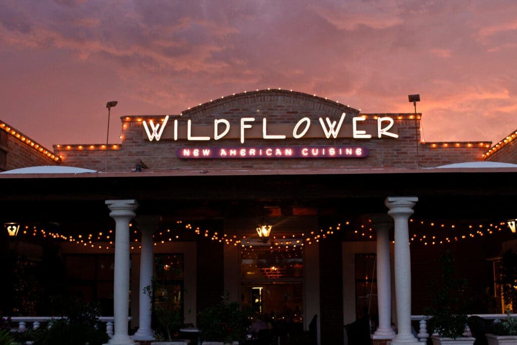 a sign in front of a building