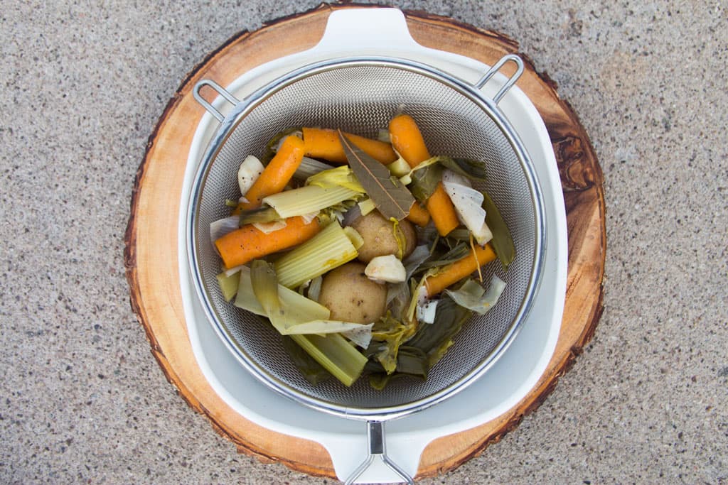 Straining vegetable broth