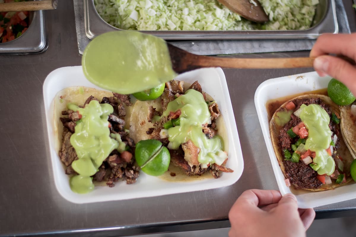 Utilizing the salsa bar at Tacos Apson (Credit: Jackie Tran)