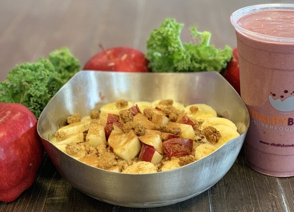 a bowl of fruit and vegetables in a cup