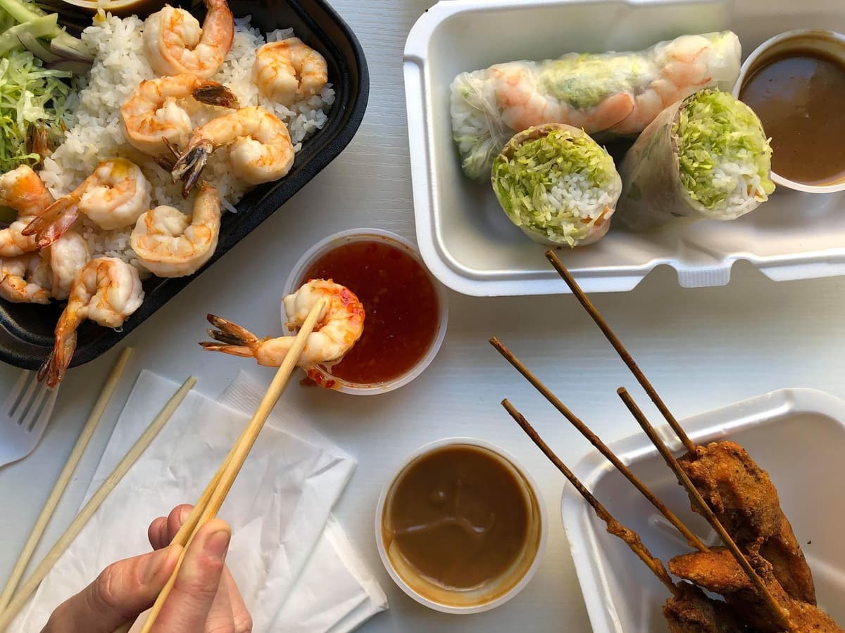 Grilled Shrimps topped with Coconut Curry Sauce on Jasmine Rice, Vietnamese Spring Rolls and Grilled Chicken Skewers with Peanut Sauce from Miss Saigon (Credit: Melissa Stihl)