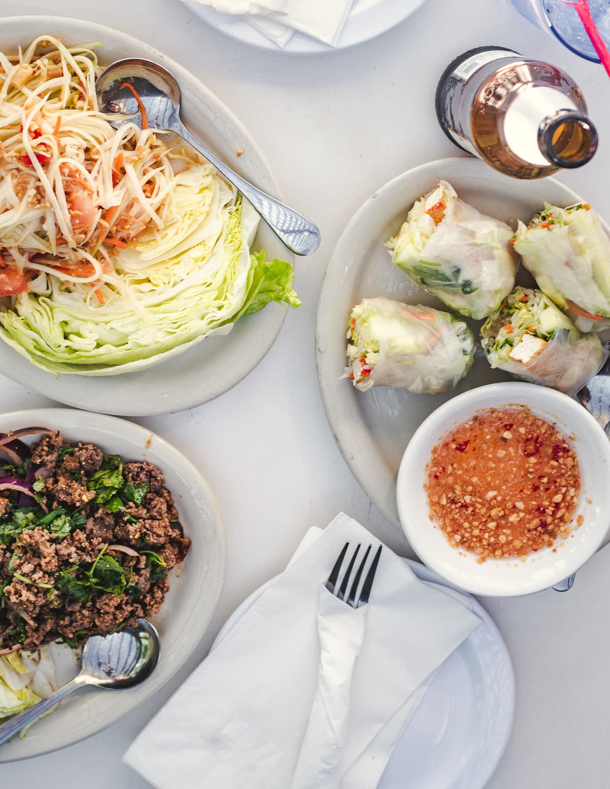 Papaya Salad, Tofu Summer Rolls, and Beef Larb at 4 Seasons Restaurant (Credit: Jackie Tran)