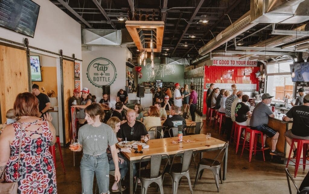 a group of people standing around a table