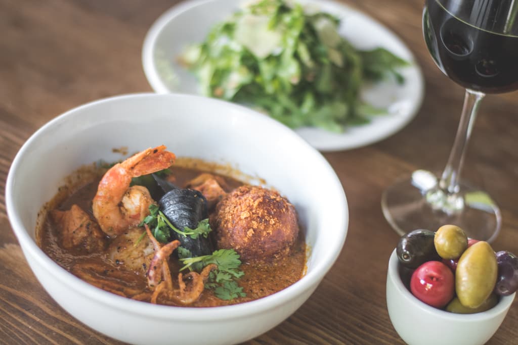 A Little Italy at Agustín Kitchen: $48 Cioppino, Salad & Cheesecake For Two