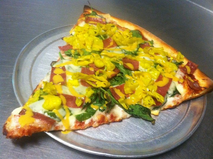 Swiss Melt pizza with swiss cheese, salami, spinach, pepperoncini and drizzled beer mustard.