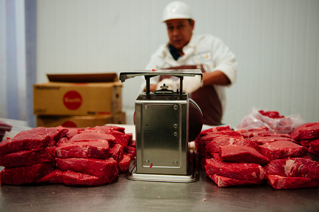 Meat prep at Merit Foods (Photo by Liora K)